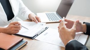 Serious,Man,Has,A,Business,Meeting,Reading,A,Resume,About